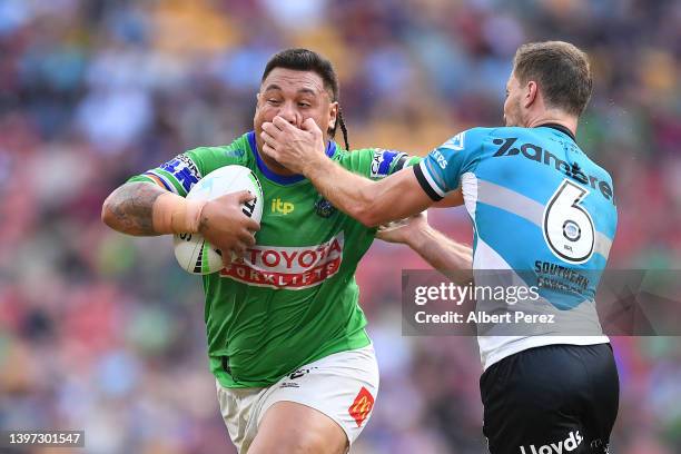 Josh Papalii of the Raiders is tackled during the round 10 NRL match between the Cronulla Sharks and the Canberra Raiders at Suncorp Stadium, on May...