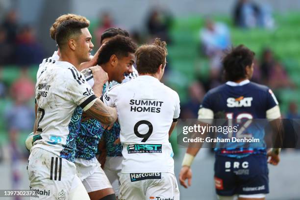 Emoni Narawa of the Chiefs is congratulated by his teammates after scoring a try during the round 13 Super Rugby Pacific match between the Melbourne...