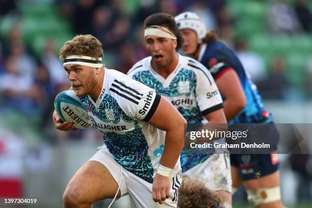 Ollie Norris of the Chiefs runs with the ball during the round 13 Super Rugby Pacific match between the Melbourne Rebels and the Chiefs at AAMI Park...