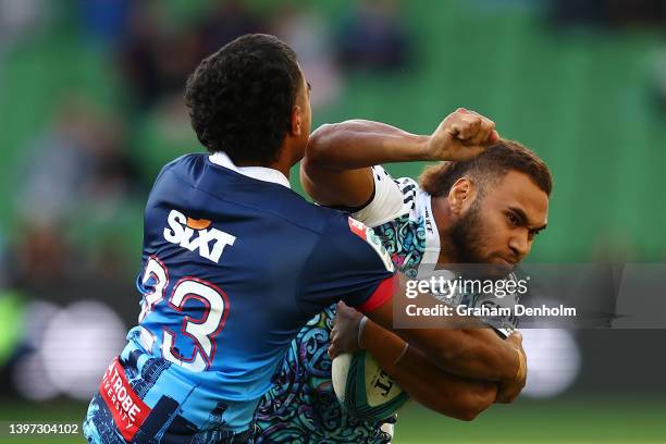 Inga Finau of the Chiefs is tackled by Lukas Ripley of the Rebels during the round 13 Super Rugby Pacific match between the Melbourne Rebels and the...