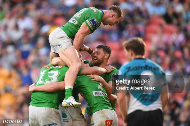 Raiders celebrate a Brad Schneider try during the round 10 NRL match between the Cronulla Sharks and the Canberra Raiders at Suncorp Stadium, on May...