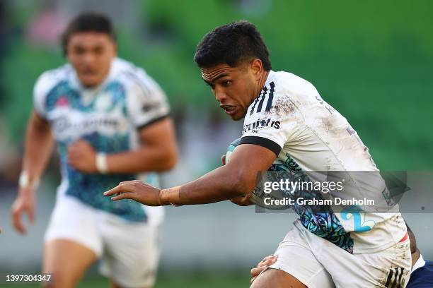 Josh Ioane of the Chiefs runs with the ball during the round 13 Super Rugby Pacific match between the Melbourne Rebels and the Chiefs at AAMI Park on...