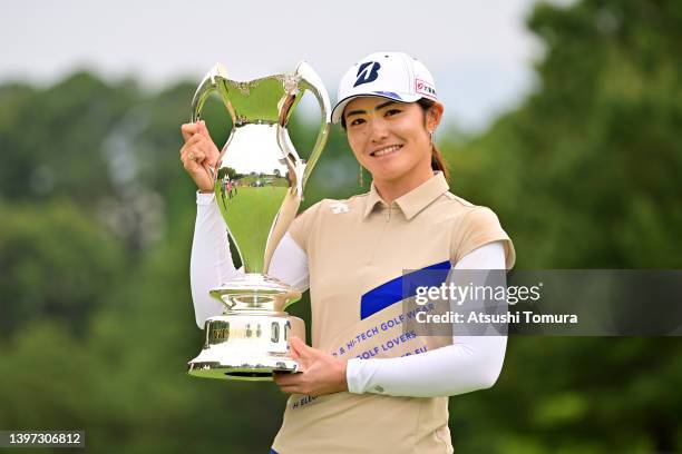 Ayaka Watanabe of Japan poses with the trophy after winning the tournament following the final round of the Hoken no Madoguchi Ladies at Fukuoka...