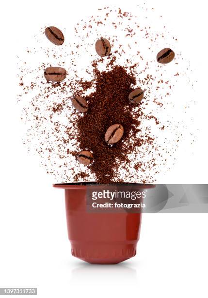 coffee capsule with roasted beans - coffee capsules stock pictures, royalty-free photos & images