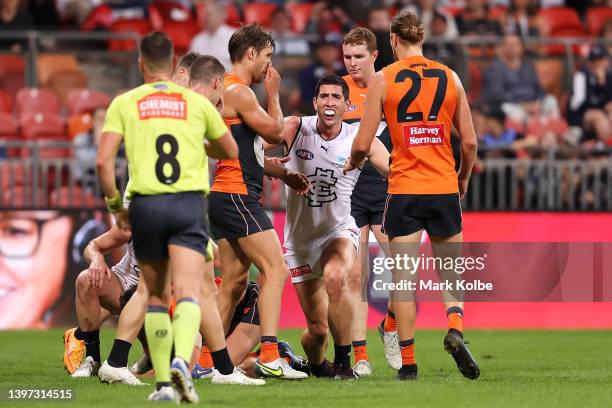 Jacob Weitering of the Blues shows his frustration to the umpire during the round nine AFL match between the Greater Western Sydney Giants and the...