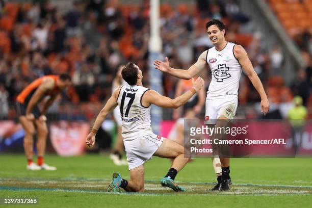 Brodie Kemp of the Blues and Jack Silvagni of the Blues celebrate winning the round nine AFL match between the Greater Western Sydney Giants and the...