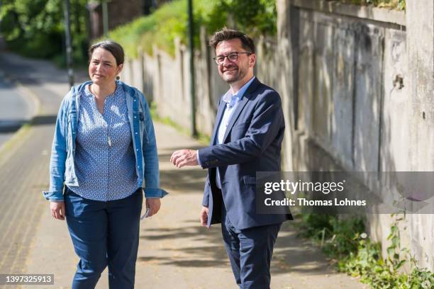 Thomas Kutschaty, lead candidate of the German Social Democrats , and his wife Christina Kutschaty leave after they casted their ballot in state...