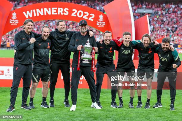 Head Coach Jurgen Klopp of Liverpool with the Cup and his backroom team after their sides 6-5 penalty shoot-out after a 0-0 draw in normal tim during...