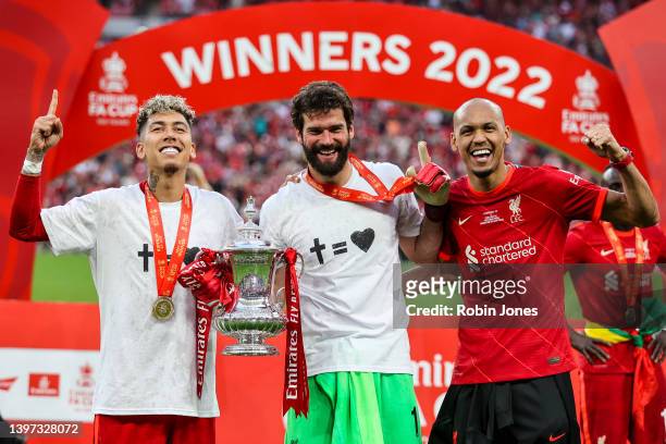 Roberto Firminho, Alisson Becker and Fabinho of Liverpool with the Cup after their sides 6-5 penalty shoot-out after a 0-0 draw in normal time during...