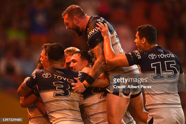 Cowboys celebrate a Reuben Cotter try during the round 10 NRL match between the Wests Tigers and the North Queensland Cowboys at Suncorp Stadium, on...