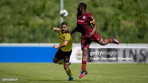 Lion Semic of Dortmund in action against Ardy Mfundu of Schalke during the A Junior German Championship Semi Final Leg Two match between Schalke 04...