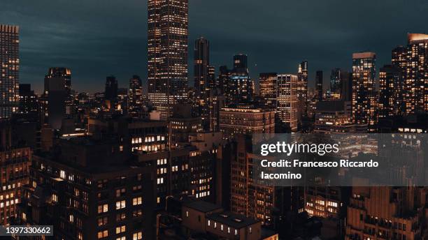 cinematic look, city at night, skyline. new york city - gotham - new york city skyline night stock pictures, royalty-free photos & images