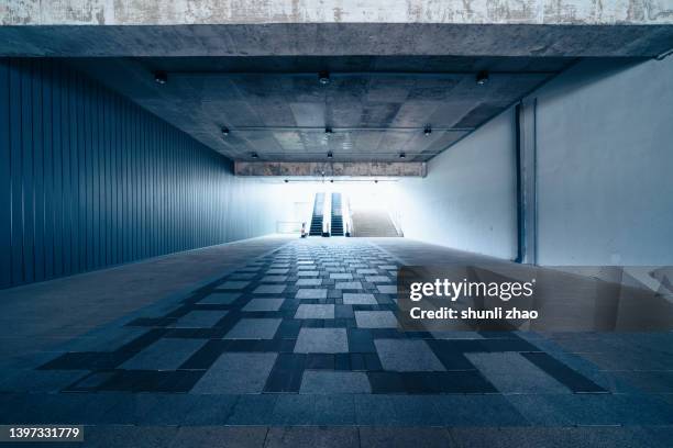 empty futuristic architecture with silver metal line wall - strassenunterführung stock-fotos und bilder