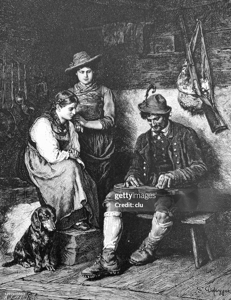 Man plays the zither in a mountain hut
