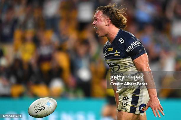 Reuben Cotter of the Cowboys celebrates scoring a try during the round 10 NRL match between the Wests Tigers and the North Queensland Cowboys at...