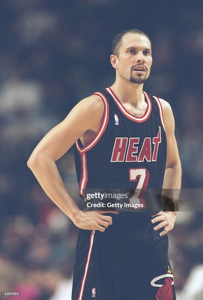 Guard Rex Chapman of the Miami Heat stands on the court during a game