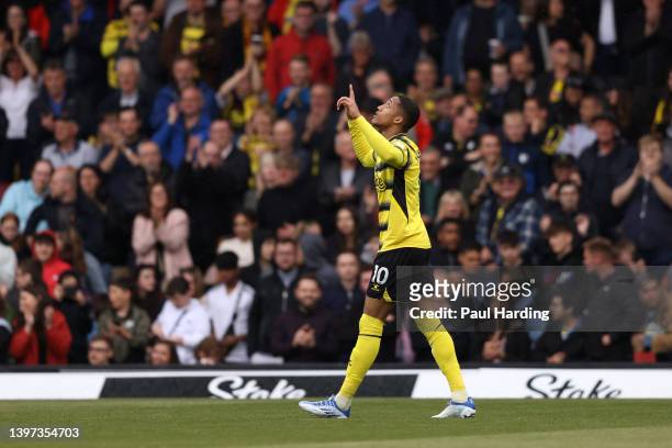 Joao Pedro of Watford FC celebrates their sides first goal during the Premier League match between Watford and Leicester City at Vicarage Road on May...