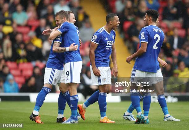 James Maddison of Leicester City celebrates their sides first goal with team mate Jamie Vardy during the Premier League match between Watford and...