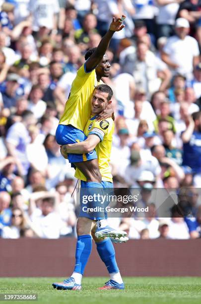 Lewis Dunk lifts Danny Welbeck of Brighton & Hove Albion whilst celebrating scoring their side's first goal during the Premier League match between...