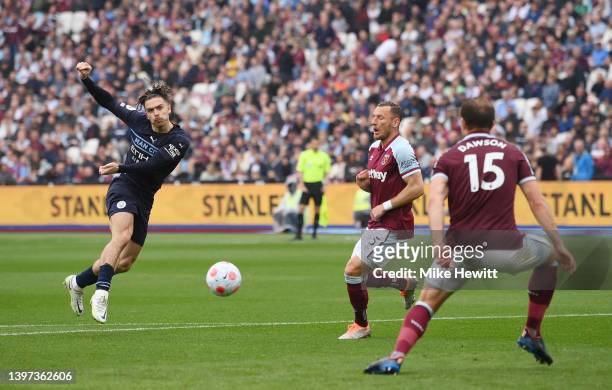 Jack Grealish of Manchester City scores their sides first goal during the Premier League match between West Ham United and Manchester City at London...