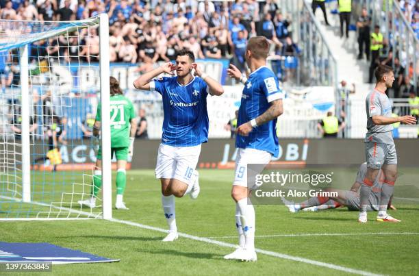 Luca Pfeiffer of SV Darmstadt 98 celebrates scoring their side's third goal with teammate Philip Tietz during the Second Bundesliga match between SV...