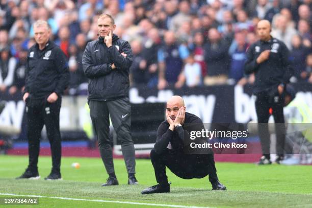 Pep Guardiola, Manager of Manchester City reacts during the Premier League match between West Ham United and Manchester City at London Stadium on May...