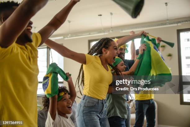 brazil fans celebrating goal - fussball fans stock pictures, royalty-free photos & images