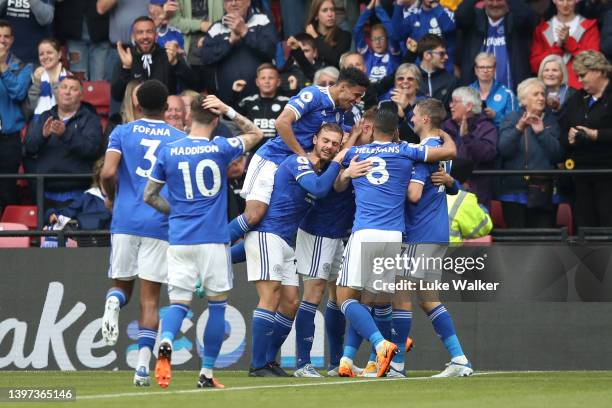 Harvey Barnes of Leicester City celebrates their sides third goal with team mates during the Premier League match between Watford and Leicester City...