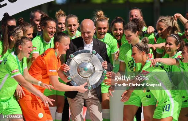 Bernd Neuendorf, DFB president hands out the champions trophy to Almuth Schult of Wolfsburg after winning the Gemran Championships after the...