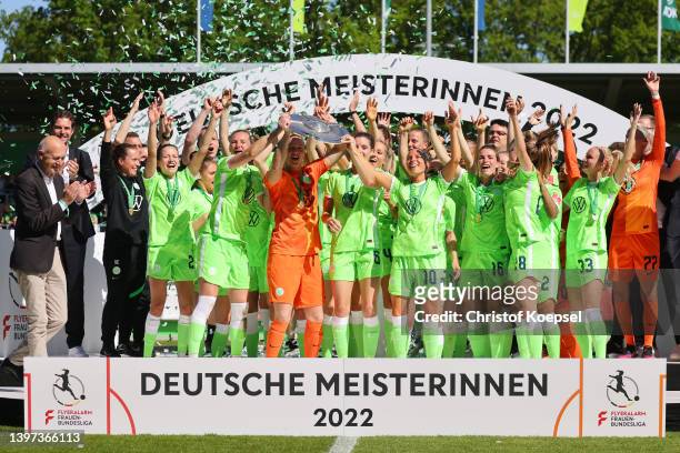 Almuth Schult of Wolfsburg lifts the championship trophy after the FLYERALARM Frauen-Bundesliga match between VfL Wolfsburg women and Bayer 04...