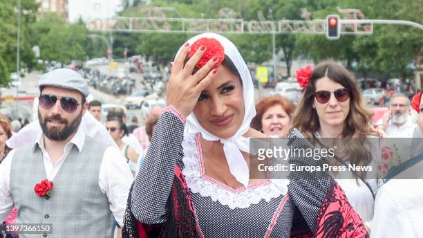The deputy mayor of Madrid, Begoña Villacia, arrives dressed in a chulapa and wearing a carnation, at the popular campaign Mass on the esplanade near...
