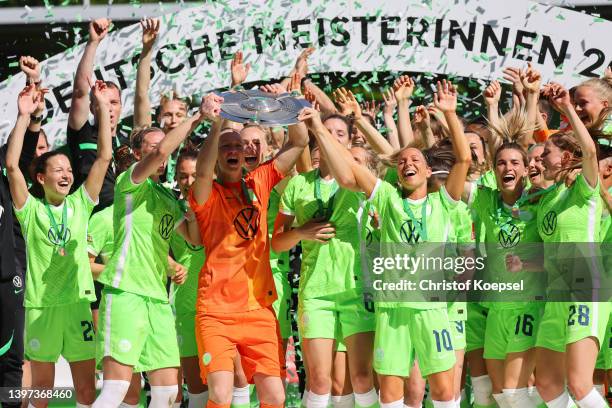 The team of Wolfsburg celebrates after winning the German Champions after the FLYERALARM Frauen-Bundesliga match between VfL Wolfsburg women and...