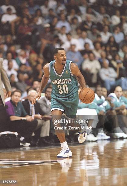 Guard Dell Curry of the Charlotte Hornets dribbles the ball down the court during a game against the Miami Heat at the Miami Arena in Miami, Florida....