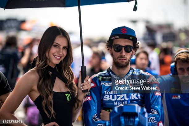 Alex Rins of Spain and Team SUZUKI ECSTAR on his bike at the starting grid next to the grid girl during the race of the MotoGP SHARK Grand Prix de...