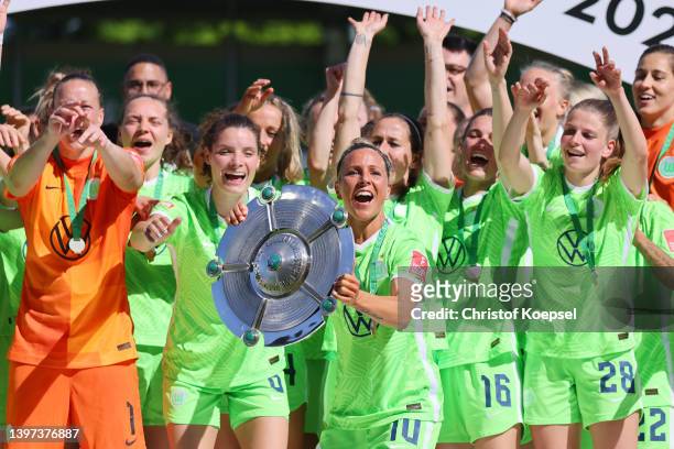 Svenja Huth of Wolfsburg lifts the championship trophy after the FLYERALARM Frauen-Bundesliga match between VfL Wolfsburg women and Bayer 04...