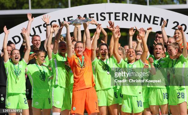 Almuth Schult of Wolfsburg lifts the championship trophy after the FLYERALARM Frauen-Bundesliga match between VfL Wolfsburg women and Bayer 04...