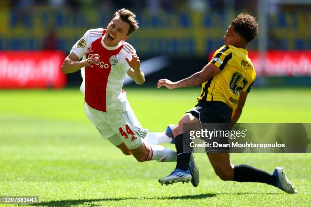 Youri Regeer of Ajax is tackled and fouled by Million Manhoef of Vitesse during the Dutch Eredivisie match between Vitesse and Ajax Amsterdam held at...