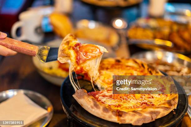 tasting pizza - chicken parmigiana stock pictures, royalty-free photos & images