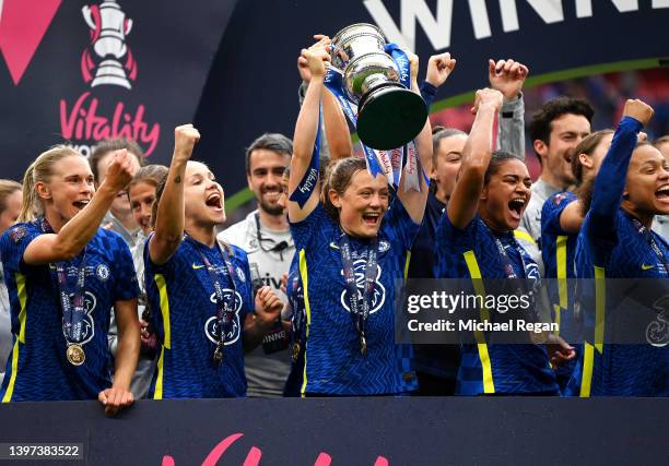 Erin Cuthbert of Chelsea lifts the Vitality Women's FA Cup trophy after their sides victory during the Vitality Women's FA Cup Final match between...