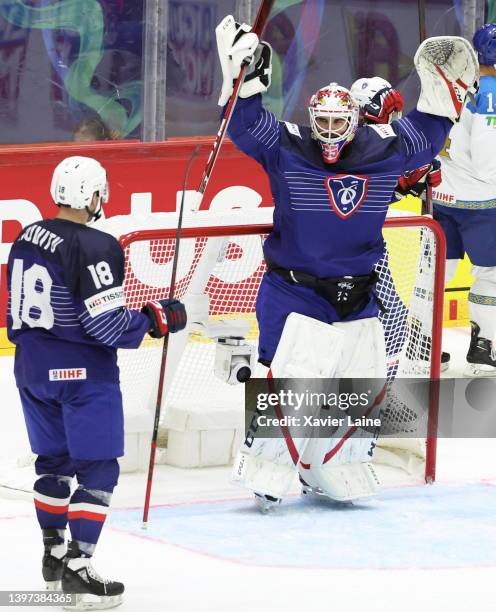 Henri Corentin Buysse of Team France celebrate the victory with Yoahann Auvitu and teammates after the 2022 IIHF Ice Hockey World Championship Group...
