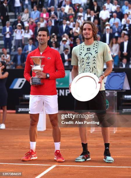 Winner Novak Djokovic of Serbia and runner up Stefanos Tsitsipas of Greece pose with their trophies following the men's singles final on Day six of...