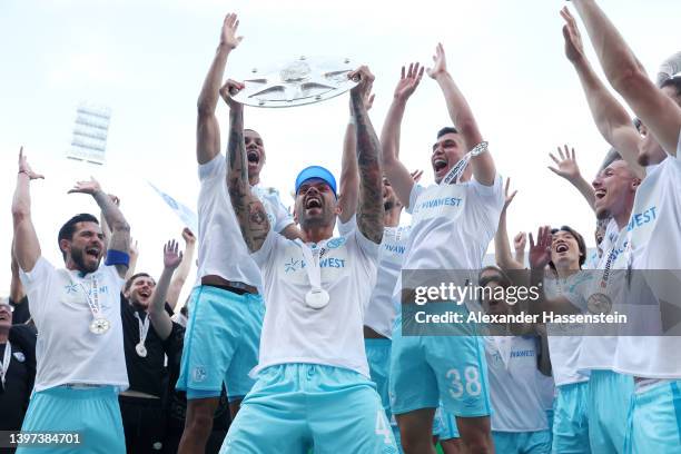 Victor Palsson of FC Schalke 04 lifts with The Meisterschale trophy after winning the 2. Bundesliga after their sides victory in the Second...