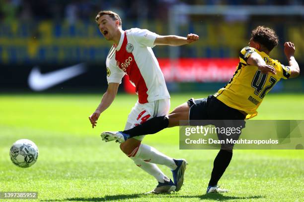 Youri Regeer of Ajax is tackled and fouled by Million Manhoef of Vitesse during the Dutch Eredivisie match between Vitesse and Ajax Amsterdam held at...