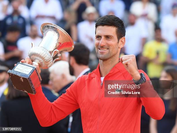 Novak Djokovic of Serbia celebrates with the Internazionali BNL D'Italia Men's Single's winners trophy after their victory against Stefanos Tsitsipas...