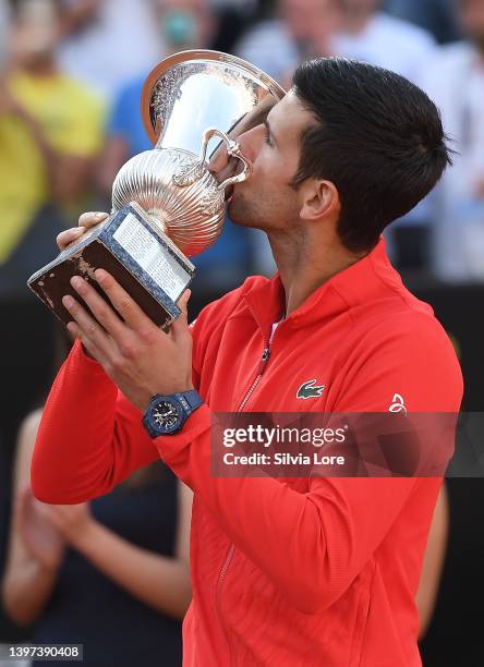 Novak Djokovic of Serbia celebrates with the Internazionali BNL D'Italia Men's Single's winners trophy after his victory against Stefanos Tsitsipas...