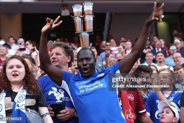 Schalke supporter celebrates after the Second Bundesliga match between 1. FC Nürnberg and FC Schalke 04 at Max-Morlock-Stadion on May 15, 2022 in...