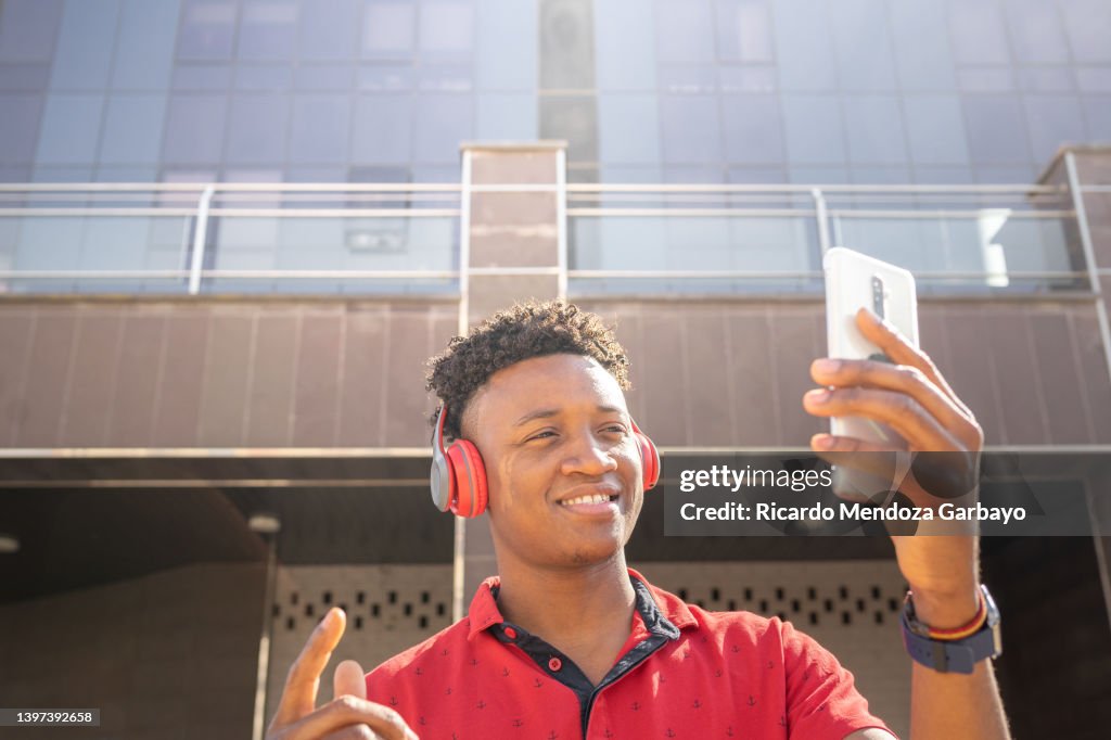 Adult man with dermatological problem enjoying music