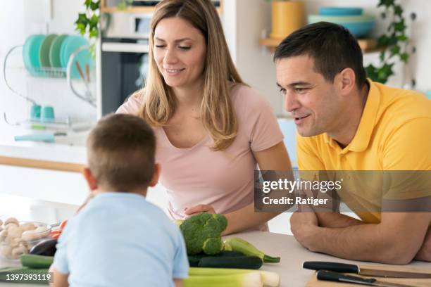 casual family preparing meal - childrens rights stock pictures, royalty-free photos & images