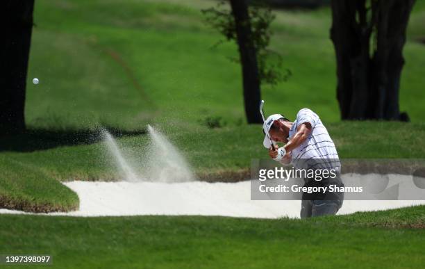 James Hahn plays a shot from a bunker on the fifth hole during the final round of the AT&T Byron Nelson at TPC Craig Ranch on May 15, 2022 in...