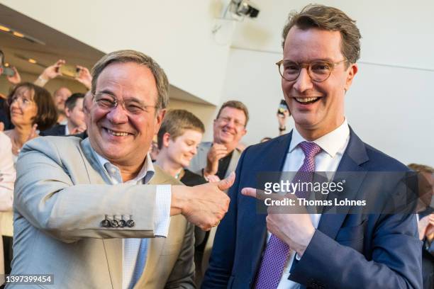 Hendrik Wuest, incumbent and top candidate of the German Christian Democrats , is congratulated by his predecessor former state premier Armin Laschet...